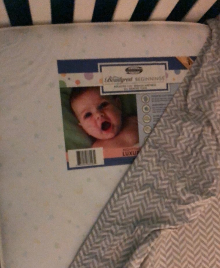 In the morning, Cibuls discovered her husband, Corey, hadn't placed a mattress cover on the crib mattress the last time he changed Lincoln's sheets, allowing a sticker of a baby's face to show through the sheet.