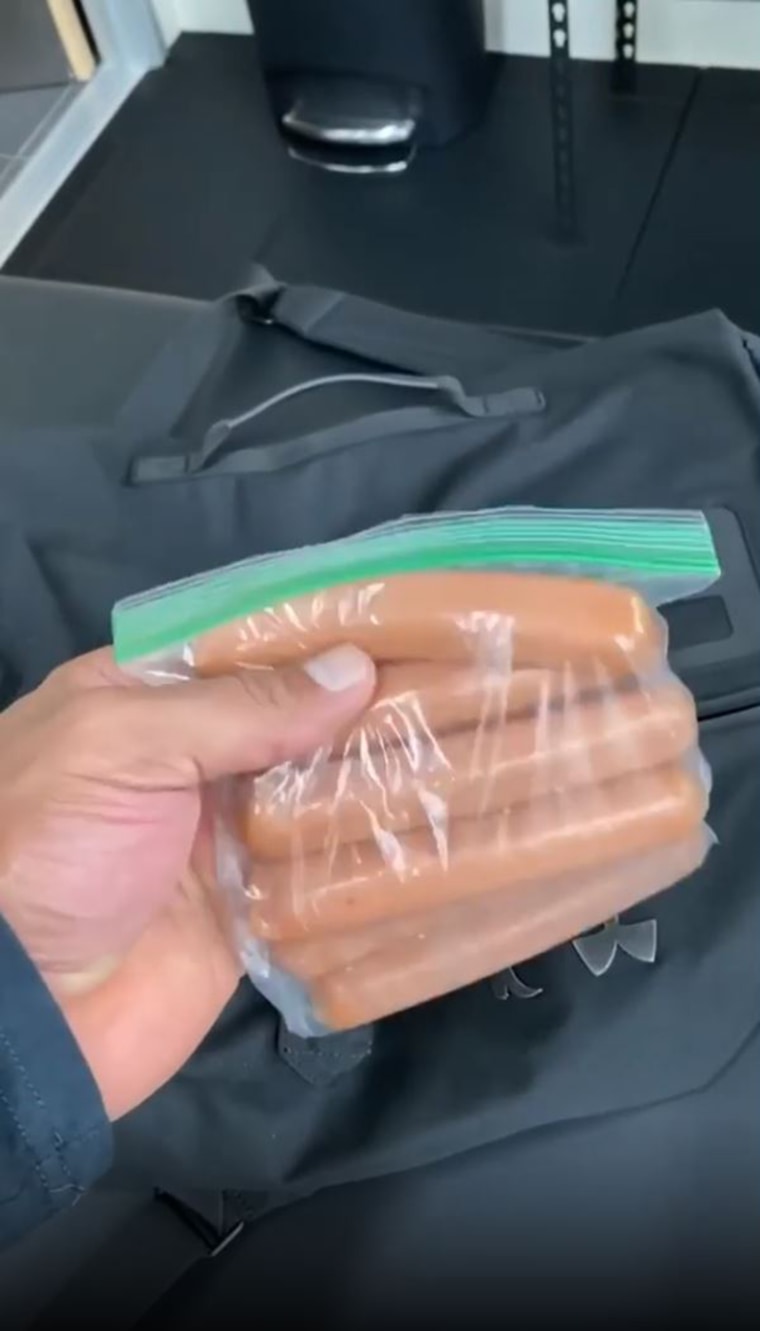 Dwayne Johnson packs himself an entire bag of raw hot dogs to eat after a workout ... because, well, he's "The Rock."