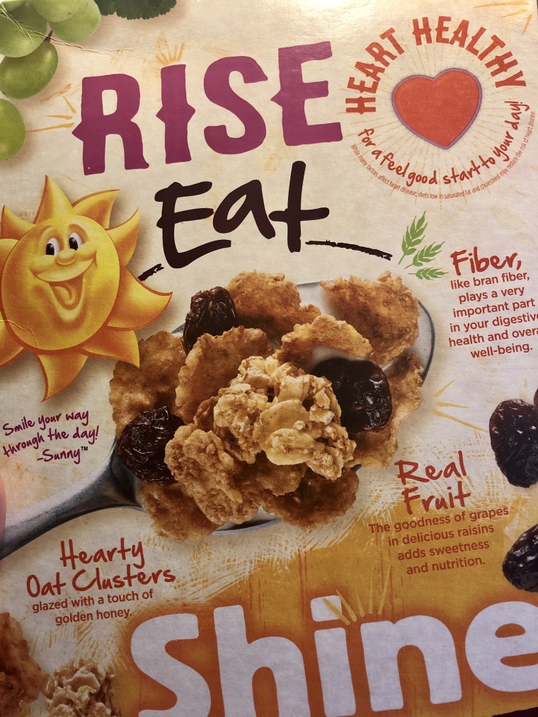 The back of a box of Kellogg's Raisin Brand Crunch shows examples of how the brand markets its cereals as being healthy, even with 19 grams of sugar per serving.