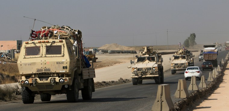 Image: A convoy of U.S. vehicles at the Iraqi-Syrian border crossing in the outskirts of Dohuk, Iraq.