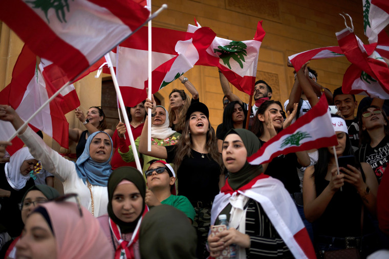 Image: Demonstrators shout slogans during an anti-government protest in downtown Beirut