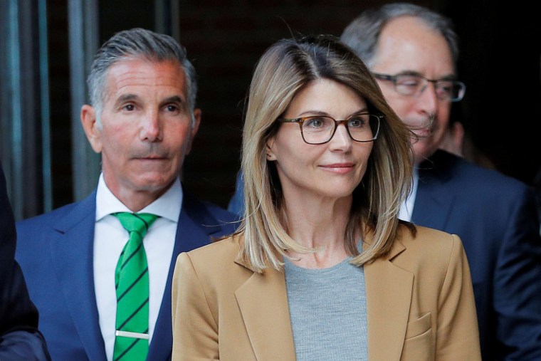 Image: Actor Lori Loughlin, and her husband, fashion designer Mossimo Giannulli, leave the federal courthouse after facing charges in a nationwide college admissions cheating scheme,