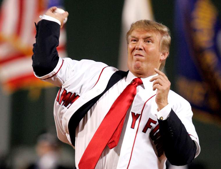 FILE PHOTO: Trump throws the first pitch before the start of the second game of an American League double header between the Boston Red Sox and New York Yankees MLB baseball game at Fenway Park in Boston