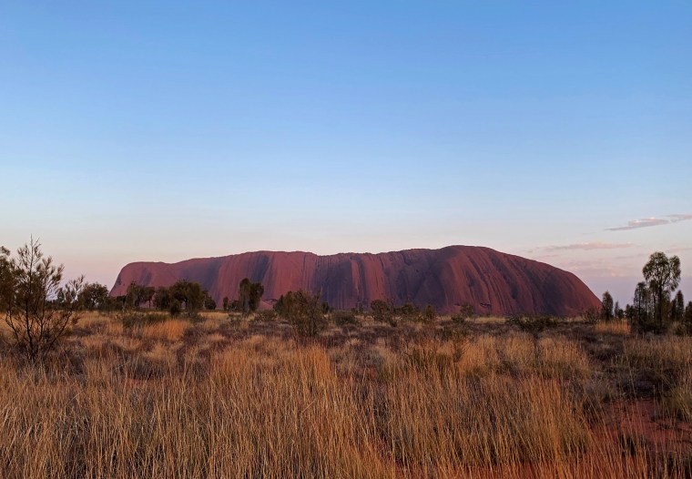 Image: Formerly known as Ayers Rock, Uluru dominates Australia's arid center at Uluru-Kata Tjuta National Park.