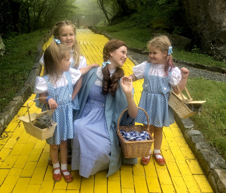 Jana Greer (center) dressed as Dorothy along with children.