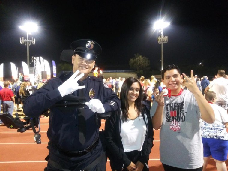 Officer Bill Weigt with his nephew Andrew, who won two gold medals in swimming at the Special Olympics Arizona. 