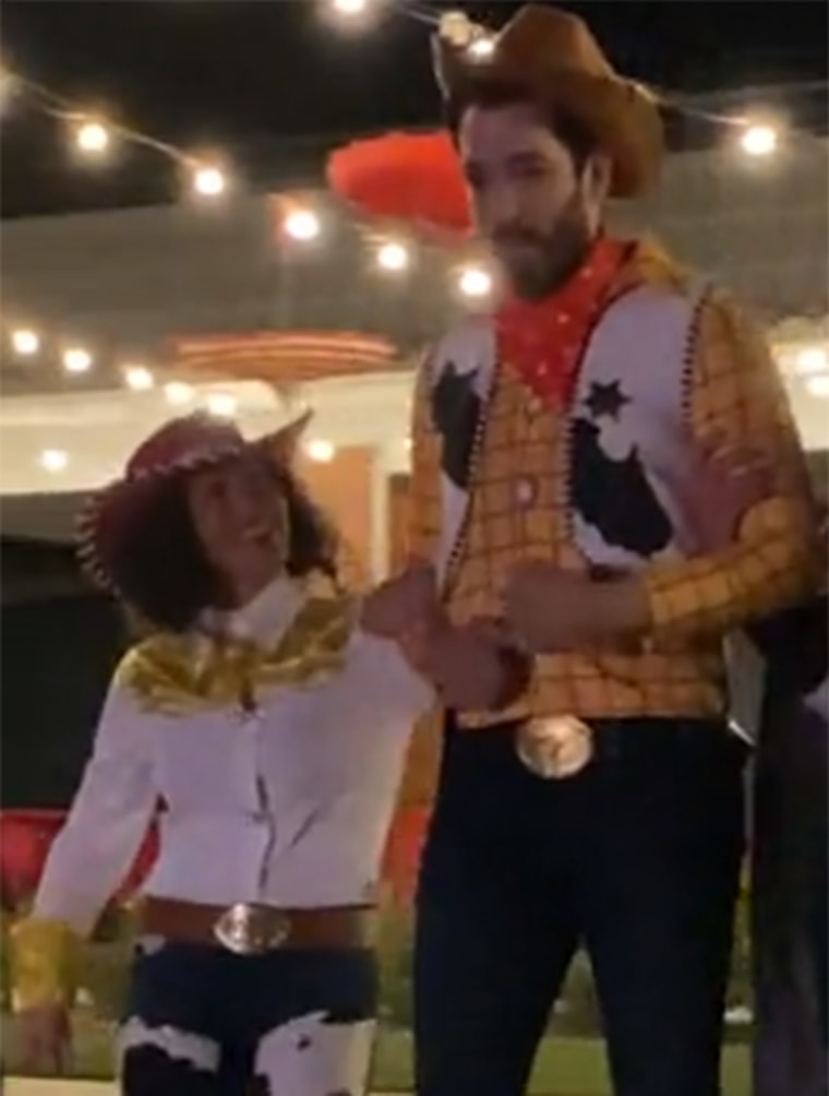Drew Scott and his wife, Linda, dressed as Woody and Jessie from "Toy Story."