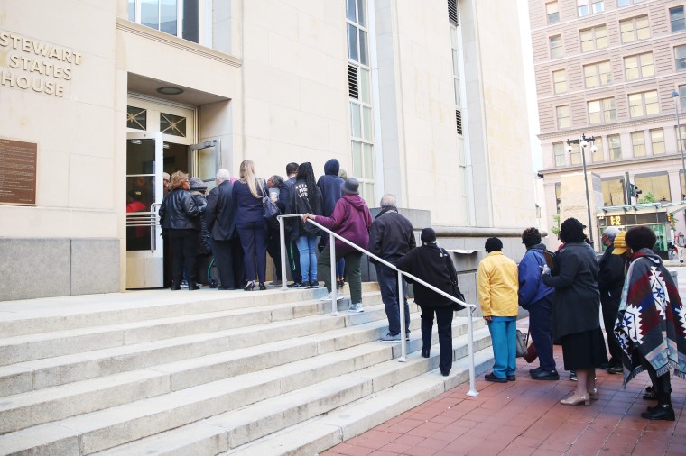Supporters of the plaintiffs in the Detroit literacy case line up to get into the courthouse