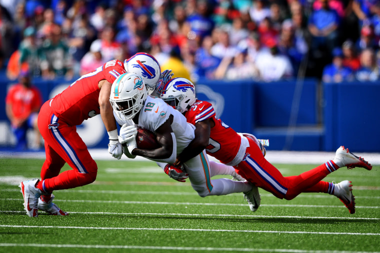 Image:Miami Dolphins wide receiver Preston Williams dives with the balls as Buffalo Bills player tackle during a game in Orchard Park, N.Y., on Oct. 20, 2019.