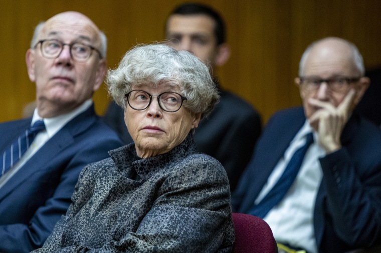 Ex-Michigan State University president Lou Anna Simon, center, listens during a preliminary hearing at the Eaton County Courthouse in Charlotte, Mich. on June 11, 2019.