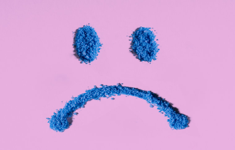 Drawing of a frown  a pink background.