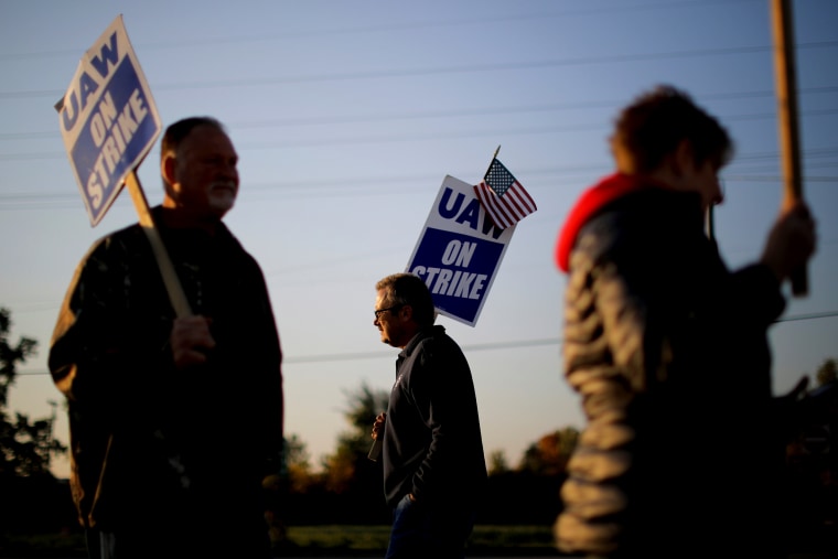 Image: Striking auto workers on the picket line outside the General Motors Flint Truck Assembly in Michigan on Oct. 9, 2019.