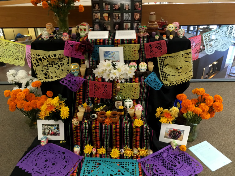 Image: An altar with flowers and pictures of the victims has been erected at the University of Texas, El Paso.