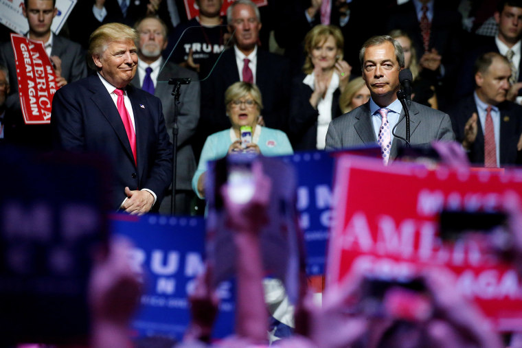 Image: Republican presidential nominee Donald Trump watches as British pro-Brexit politician Nigel Farage speaks at a campaign rally in Jackson, Mississippi