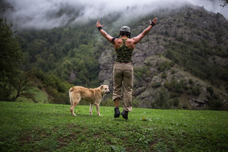 Sabour, who trains every day no matter where she is, does her morning exercise routine Sept. 22, 2014, while traveling with a friend in Talesh, in northern Iran.