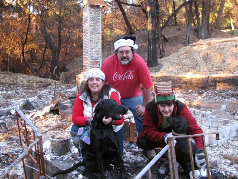 The Frazee family posing for their Christmas card photo in the charred remains of their home, after the Tubbs fire in 2017.