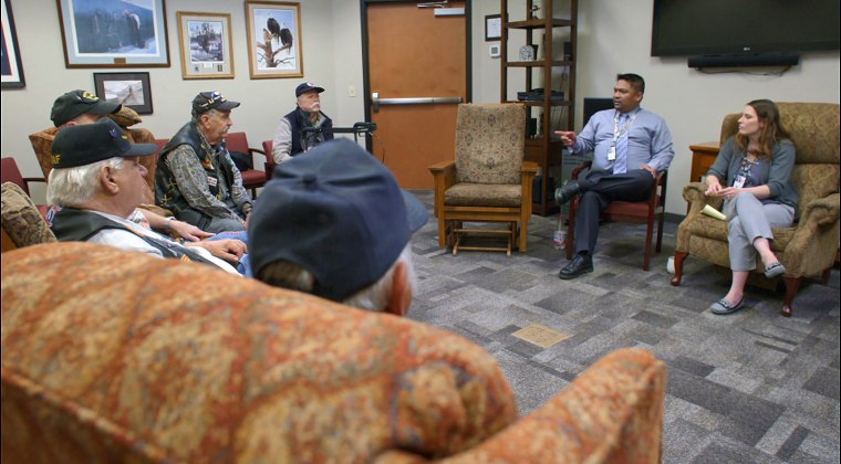 VA vet center "readjustment" counselors meeting with combat veteran clients in a group session at the U.S. Department of Veterans Affairs' Spokane Vet Center in Spokane, Washington on August 27, 2018.