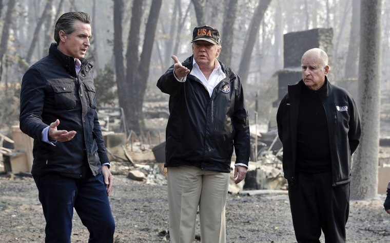 Image: President Donald Trump and Governor-elect Gavin Newsom visit a neighborhood impacted by the wildfires in Paradise, Calif., on Nov. 17, 2018.