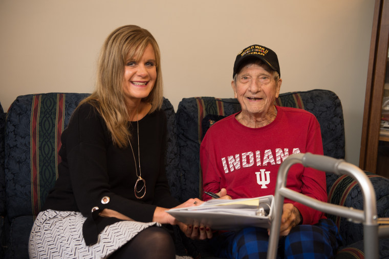 Medical foster home program coordinator Lori Paris spends time with World War II veteran Norman Miller.