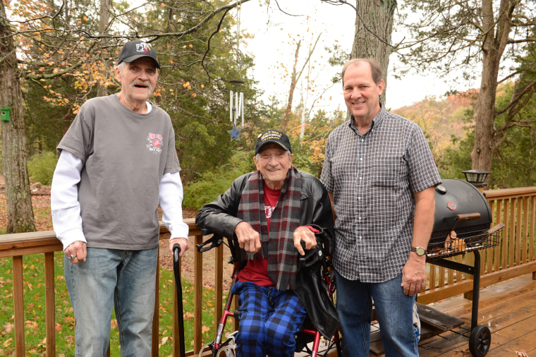 Vietnam War veteran Carroll Botts (far left) and World War II veteran Norman Miller (center) live with caregiver Barney Musselman in a medical foster home in Indiana.