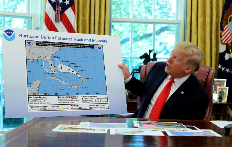 Image: UPresident Donald Trump holds an early projection map of Hurricane Dorian in the Oval Office on Sept. 4, 2019.