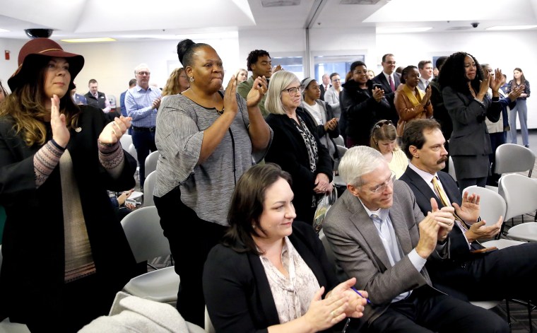 People applaud after the Pardon and Parole Board read the names of 527 Oklahoma inmates recommended for commutation at the Kate Barnard Correctional Center in Oklahoma City on Nov. 1, 2019. Oklahoma will release more than 400 inmates after a state panel approved what they say is the largest single-day mass commutation in U.S. history.