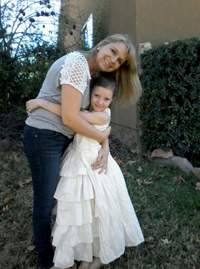 Image: Mckenzie Langford, 9, with her mother Dawna, who was killed in the attack.