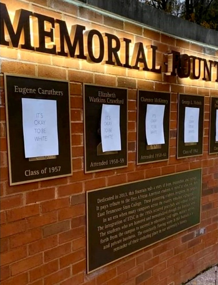 Image: In a photo submitted to WCYB, signs reading "It's Okay to be White" cover a memorial honoring the first African-American students to enroll at East Tennessee State University.