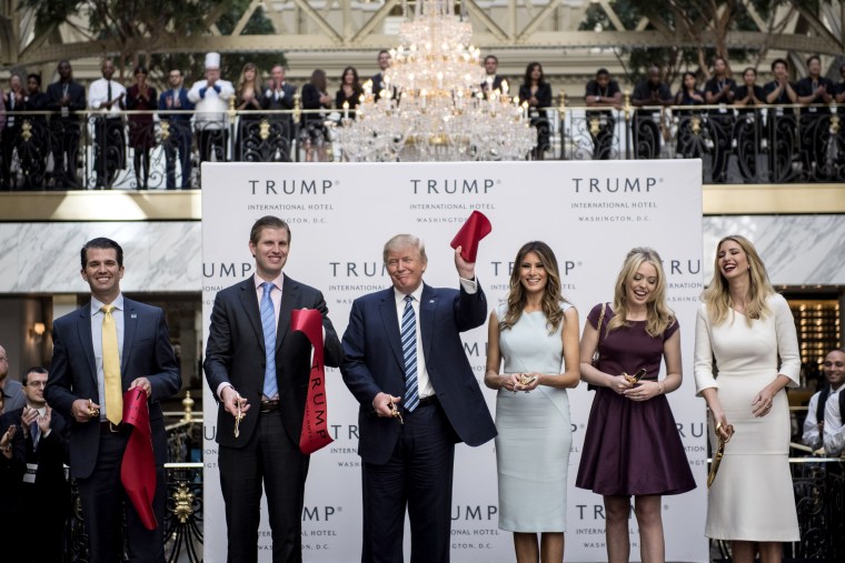 Image: Donald Trump, accompanied by Donald Trump Jr., Eric Trump, Melania Trump, Tiffany Trump and Ivanka Trump, at the opening ceremony of the Trump International Hotel in Washington on Oct. 26, 2016.