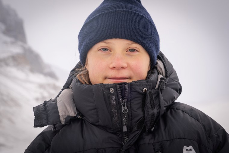 Image: Teen Swedish climate activist Greta Thunberg poses as she visits the Athabasca Glacier