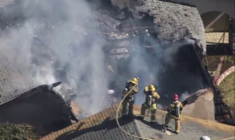 Firefighters respond to small plane that crashed into a house in Upland, Calif.