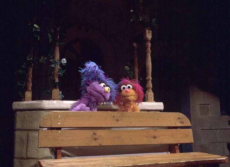 Israeli muppet Dafi, left, visits Palestinian muppet Haneen on the set of a Palestinian street on April 1, 1997 during the taping of a joint Israeli-Palestinian production of Sesame Street.