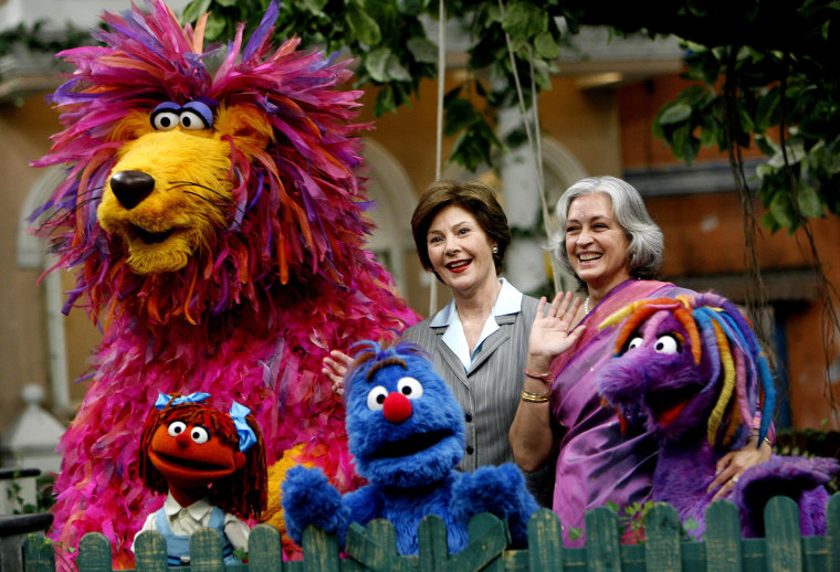 First lady Laura Bush, accompanied by Nafisa Ali, the chairperson of the Children's Film Society of India, meets the cast "Galli Galli Sim Sim," India's production of Sesame Street in 2006.