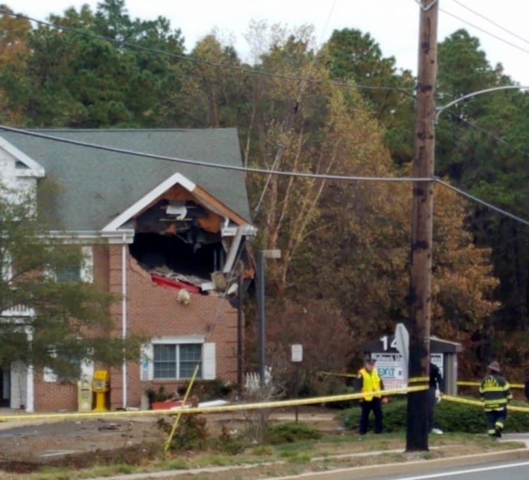 Image: Two people are dead after a Porsche crashed through the second floor of a building on Toms River, N.J, on Nov. 10, 2019.