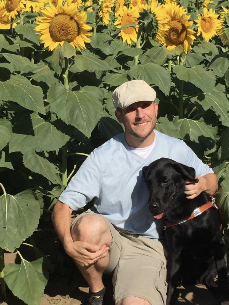 Tim and his service dog, Barney.