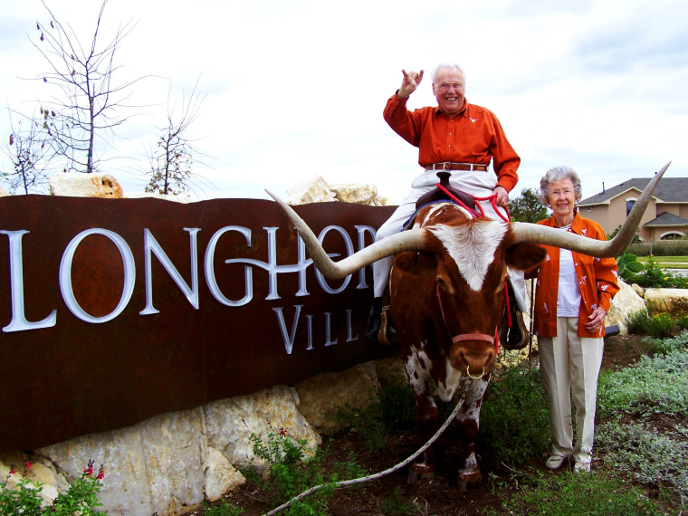 The Hendersons enjoy watching sports together at Longhorn Village retirement community, where they have lived for the past decade. John Henderson played football for the University of Texas. 