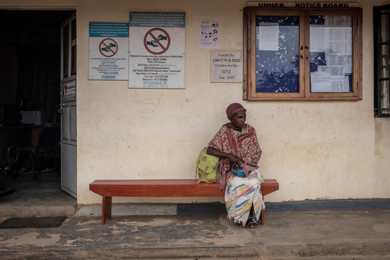 A woman sits outside the UNHCR office at the Nakivale refugee settlement in southwest Uganda in 2018.