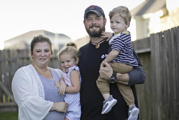 Melissa and Dillon Bright with their children, Charlotte and Mason, outside their Tomball, Texas home.