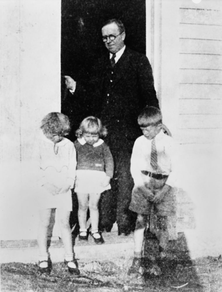 The future president's father, James Earl Carter Sr., ran a grocery store and peanut farm in Plains. He also served in the Georgia House of Representatives until his death in 1953. In this photo he is seen with Jimmy (right), Gloria (left) and Ruth in front of his store in 1932.