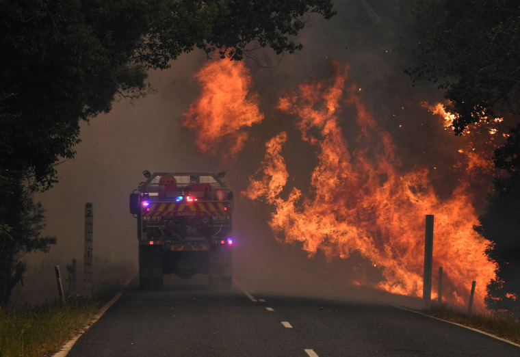 A fire truck near a bushfire in Nana Glen, near Coffs Harbour, Australia