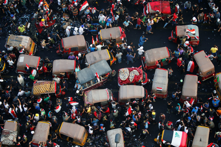 Image: Demonstrators and tuk tuk drivers take part in protests 