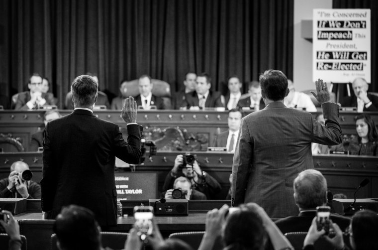 Image: Bill Taylor and George Kent are sworn-in to testify at a House Intelligence Committee hearing on impeachment on Nov. 13, 2019.