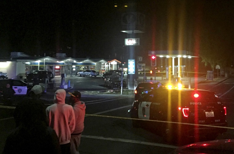 Image: Onlookers and police at the scene of a fatal shooting at a Vallejo, Calif., gas station on Nov. 10, 2019.