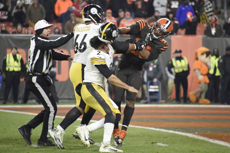 Quarterback Mason Rudolph #2 of the Pittsburgh Steelers fights with defensive end Myles Garrett #95 of the Cleveland Browns during the second half at FirstEnergy Stadium on November 14, 2019 in Cleveland, Ohio. The Browns defeated the Steelers 21-7.