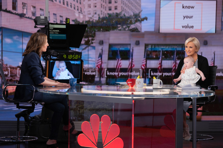 Leigh Gallagher chats with Mika Brzezinski, who holds baby Maren Grace Gallagher, during an interview with Know Your Value.