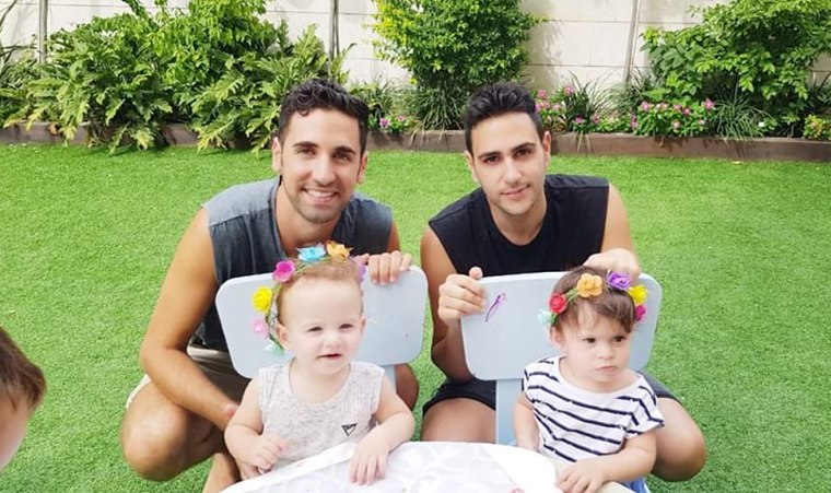Guy Sadaka (left) and Hai Aviv with their 2-year-old twins.