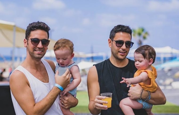 Guy Sadaka (left) and Hai Aviv with their 2-year-old twins.