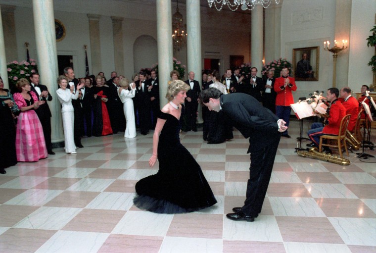 Princess Diana dances with John Travolta in the Cross Hall of the White House in Washington, D.C at a Dinner for Prince Charles and Princess Diana of the United Kingdom on November 9, 1985 Mandatory