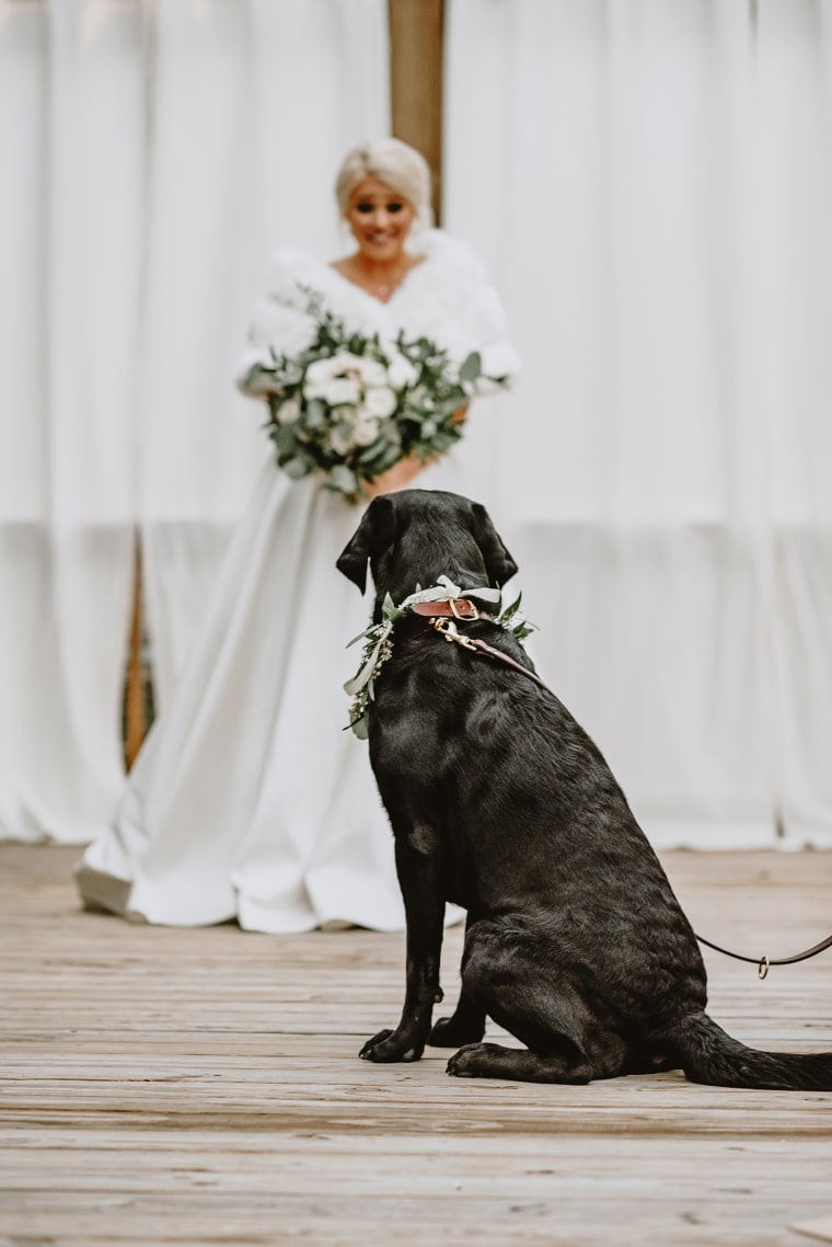 Bride poses for 'first look' photos with dog