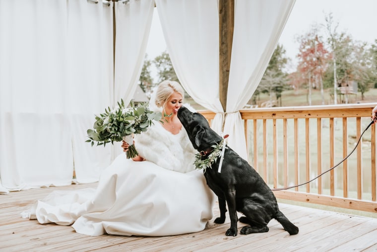 Bride poses for 'first look' photos with dog